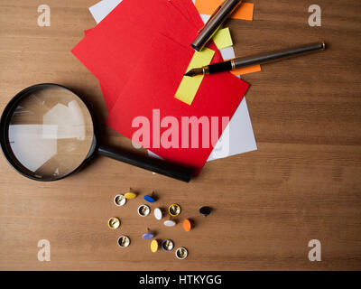 Fountain pen and magnifying glass on letter Stock Photo - Alamy