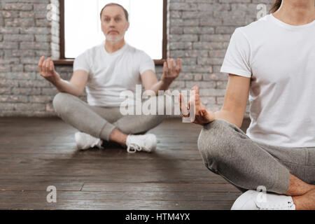 Concentrated bearded man looking straight Stock Photo