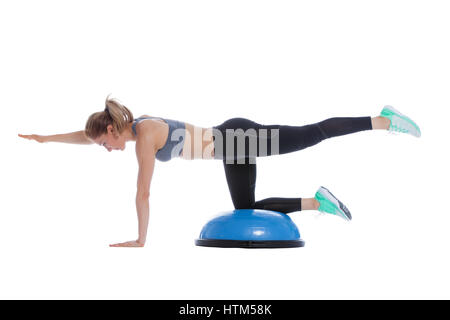 Balance training ball exercise execution with a professional trainer ...