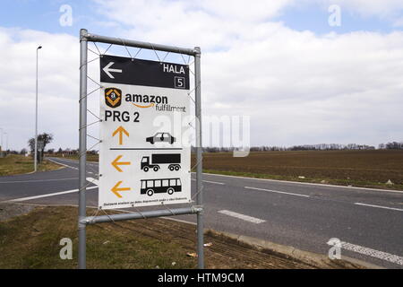 DOBROVIZ, CZECH REPUBLIC - MARCH 12: Road sign to online retailer company Amazon fulfillment logistics building on March 12, 2017 in Dobroviz, Czech r Stock Photo