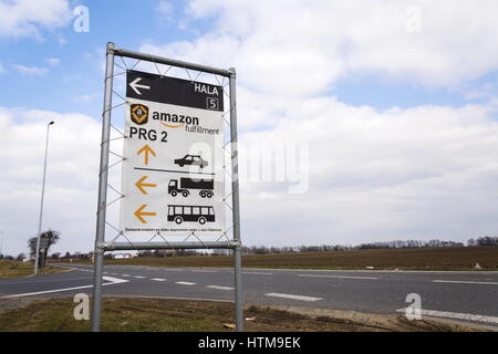 DOBROVIZ, CZECH REPUBLIC - MARCH 12: Road sign to online retailer company Amazon fulfillment logistics building on March 12, 2017 in Dobroviz, Czech r Stock Photo