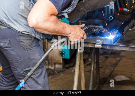 Welding in a workshop Stock Photo