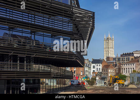 De Krook, new public library and tower of the Saint Bavo Cathedral / Sint-Baafskathedraal in the city center of Ghent, East Flanders, Belgium Stock Photo