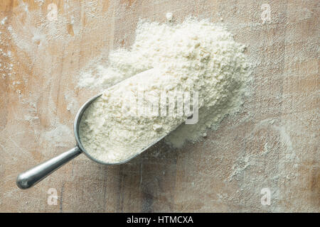 The wheat flour in metal scoop. Stock Photo