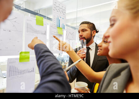 Business team brainstorming and analyzing strategy in teamwork Stock Photo
