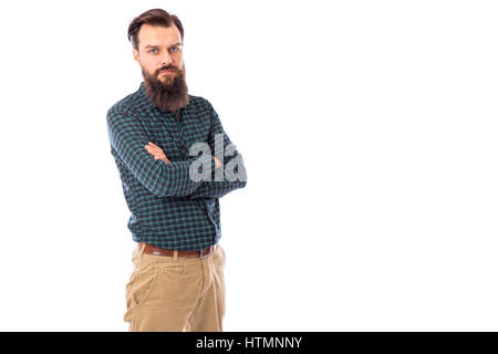 Handsome young bearded man with arms folded over white background Stock Photo