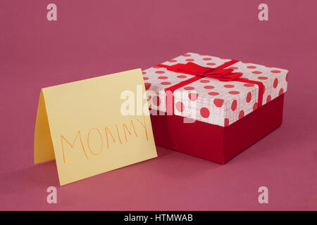 Happy mothers day card with gift box on pink background Stock Photo