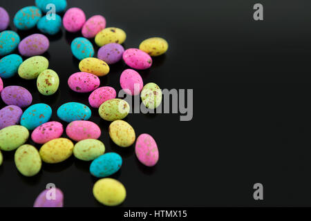 Close-up of multicolored Easter eggs on black background Stock Photo