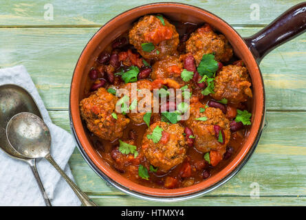 Smoky Mexican meatball stew in a pot - top view Stock Photo