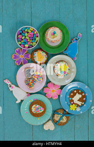 Various sweet foods and cookies in plate on wooden surface Stock Photo