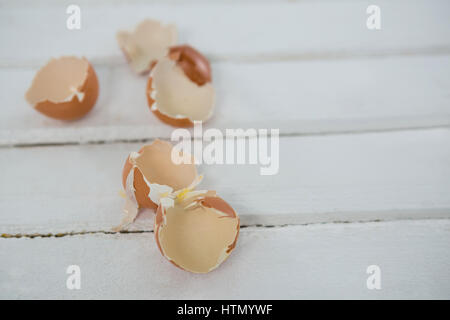 Close-up of broken Easter egg on wooden surface Stock Photo