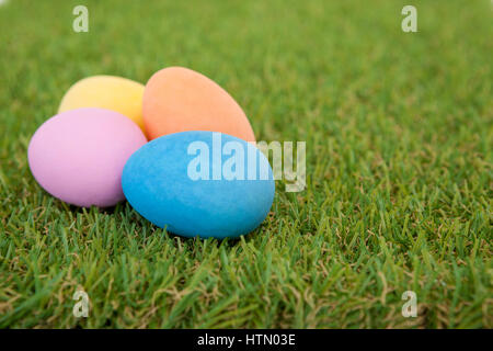 Various painted Easter eggs arranged on grass Stock Photo