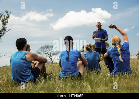 Male trainer taking attendance in the bootcamp Stock Photo
