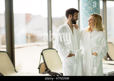 Happy coupleenjoying treatments and relaxing at wellness spa center Stock Photo