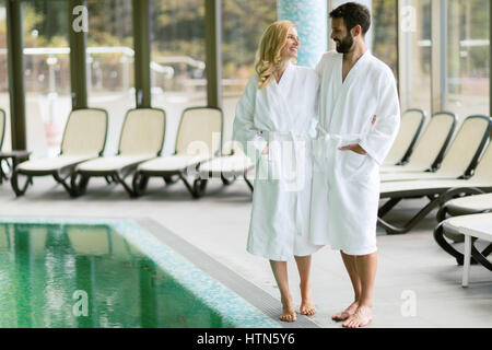 Happy coupleenjoying treatments and relaxing at wellness spa center Stock Photo