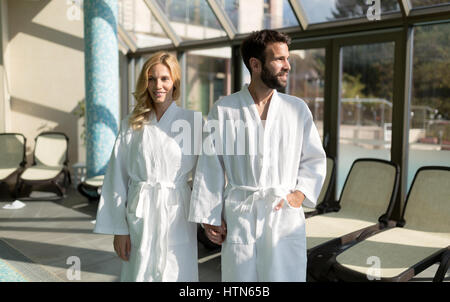 Happy coupleenjoying treatments and relaxing at wellness spa center Stock Photo