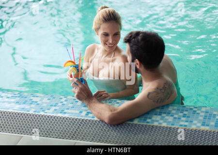 Happy coupleenjoying treatments and relaxing at wellness spa center Stock Photo