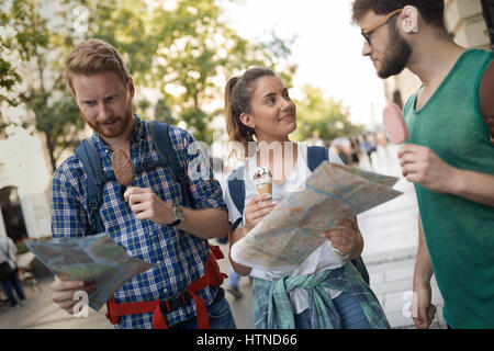 Travelling young people sightseeing and eating ice creams Stock Photo