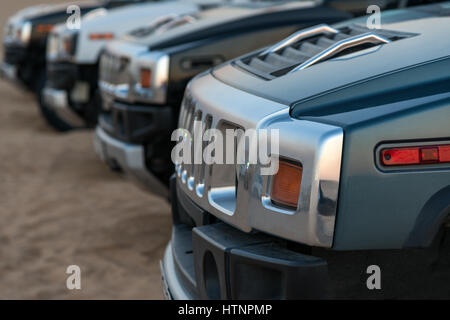Row of SUV in desert Stock Photo