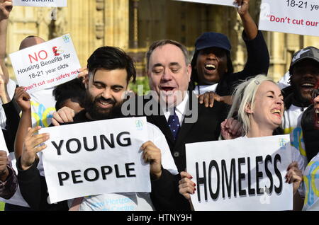 London, UK. 13th Mar, 2017. Alex Salmond MP is persuaded to join a protest against cutting housing benefits to young people after they interrupt his TV interview. Credit: PjrFoto/Alamy Live News Stock Photo