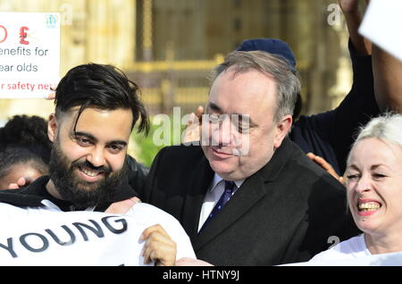 London, UK. 13th Mar, 2017. Alex Salmond MP is persuaded to join a protest against cutting housing benefits to young people after they interrupt his TV interview. Credit: PjrFoto/Alamy Live News Stock Photo