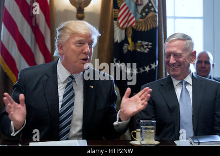 Washington DC, USA 13th March, 2017 US President Donald J Trump (L) speaks beside Secretary of Defense Jim Mattis (R) during a meeting with members of his Cabinet in the Cabinet Room of the White House in Washington, DC, USA, 13 March 2017 Stock Photo