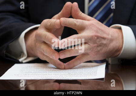 Washington DC, USA 13th March, 2017 The hands of US President Donald J Trump while attending a meeting on healthcare in the Roosevelt Room of the White House in Washington, DC, USA, 13 March 2017 The House Republicans' bill known as the 'American Health C Stock Photo