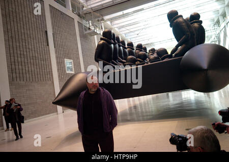 Prague, Czech Republic. 16th Mar, 2017. Chinese conceptual artist Ai Weiwei showing his installation with of a 70 meter long rubber boat with 280 larger-than-life figures of refugees hanging from the ceiling of the National Gallery in Prague, Czech Republic, 16 March 2017. With this work the artist deals with the refugee crisis. - NO WIRE SERVICE- Photo: Michael Heitmann/dpa/Alamy Live News Stock Photo