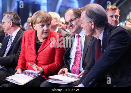Berlin, Germany. 16th Mar, 2017. German Chancellor Angela Merkel (2nd L) talks with an attendee before the opening of the Demography Summit of German Federal Government 2017 in Berlin, capital of Germany, on March 16, 2017. Credit: Shan Yuqi/Xinhua/Alamy Live News Stock Photo