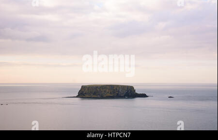 The iconic Sheep Island off the north coast of Ireland. Stock Photo