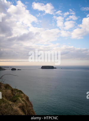 The iconic Sheep Island off the north coast of Ireland. Stock Photo