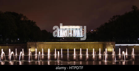 Washington DC, USA - April 28 2014: The Lincoln Memorial with the fountains of the World War II Memorial at night. Stock Photo
