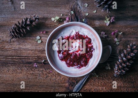 Yogurt with sour cherries jam drizzle Stock Photo