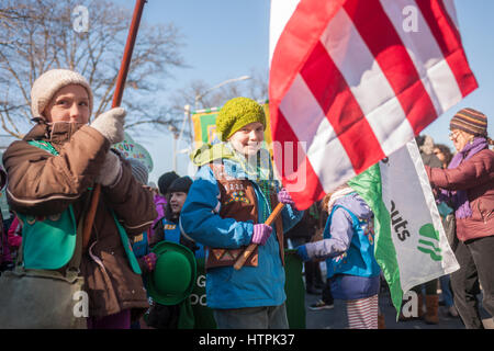 Local Girl Scout troops march in the Sunnyside, Queens St. Patrick's Parade on March 5, 2017. Billed as 'St. Pat's For All' the festive event started as an alternative to the New York parade, and organizers have endeavored to make the parade inclusive allowing gays and lesbians to march who were banned from the New York parade. (© Richard B. Levine) Stock Photo