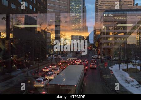reflections of a sunrise on the buildings of downtown Calgary Alberta Stock Photo