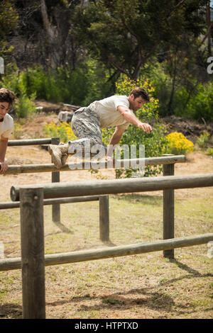 Military soldiers training on fitness trail at boot camp Stock Photo