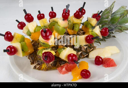 Dessert fruit chunks of pineapple, cherry, kiwi, orange, banana, apple and grapefruit. Stock Photo