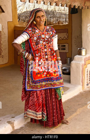 Beautifully dressed Meghwal Harijan woman outside her home in Ludia, Gujarat, India Stock Photo