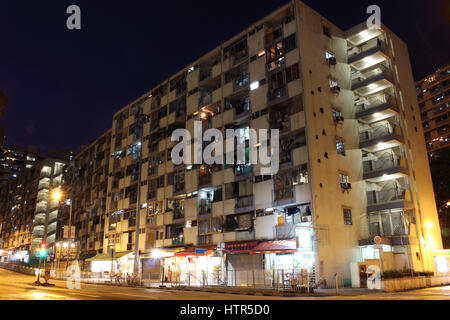 Exterior of an old public housing built by the government in ngau tau kok, Hong Kong, at night Stock Photo