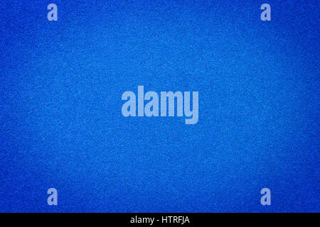 Blue velvet textured paper close up,  light center for copy space. Texture and background Stock Photo