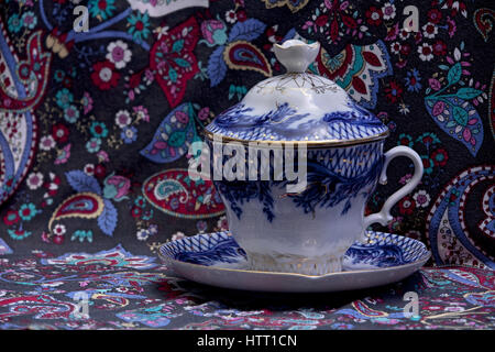 Luxurious tea cup saucer porcelain Blue gold floral pattern Stock Photo