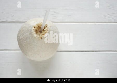 coconut fruit with drinking straw to drink fresh coconut water Stock Photo