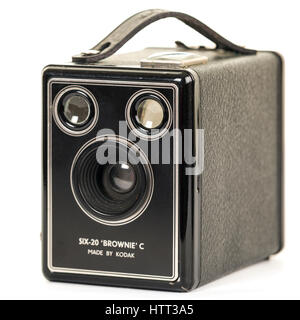 Old Kodak Six-20 Brownie C analogue camera isolated on white background  Model Release: No.  Property Release: No. Stock Photo