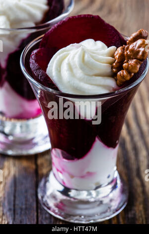 Salad with beet, cottage cheese and walnuts served in a glass Stock Photo