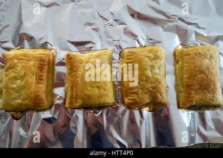 Greek Cuisine. Freshly Baked Small Spanakopita Spinach and Cheese Pies Stock Photo