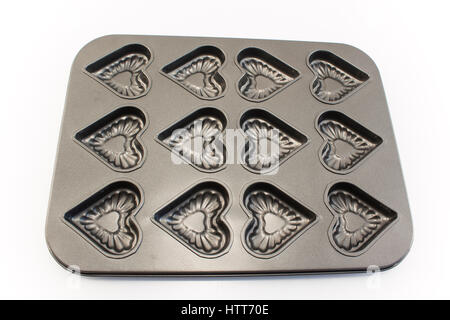 Baking Tray of Cookies in the Shape of Heart Isolated on White. Stock Photo