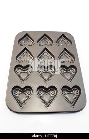 Baking Tray of Cookies in the Shape of Heart Isolated on White. Stock Photo