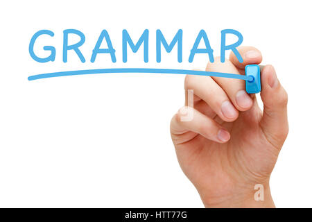 Hand writing Grammar with blue marker on transparent glass board. Stock Photo