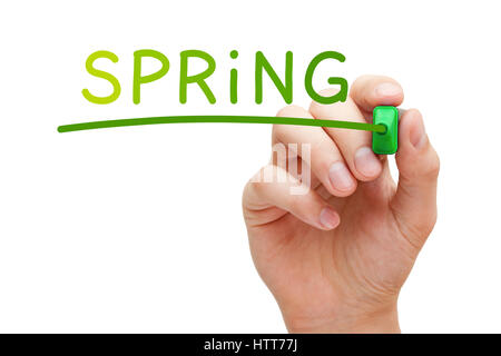 Hand writing Spring concept with different warm colored markers on transparent glass board. Stock Photo