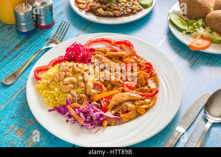 A Plate of Mexican Chicken Meal on Blue Table Stock Photo